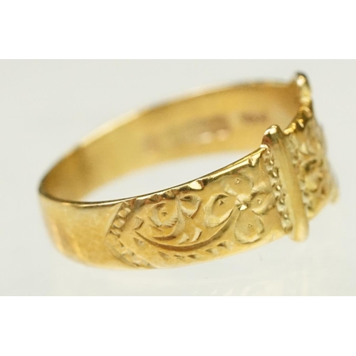 138 - Two 9ct gold rings to include a buckle ring (hallmarked Birmingham 1994, size H.5) together with a u... 