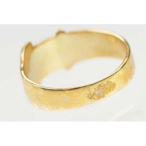 138 - Two 9ct gold rings to include a buckle ring (hallmarked Birmingham 1994, size H.5) together with a u... 