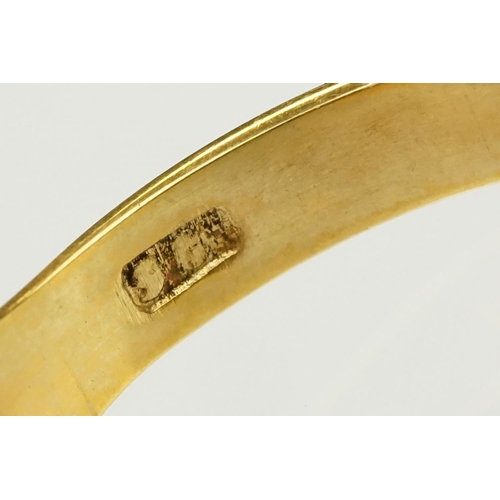 138 - Two 9ct gold rings to include a buckle ring (hallmarked Birmingham 1994, size H.5) together with a u... 