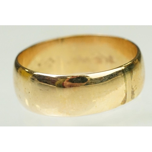 142 - 14ct gold wide band ring of D form. Marked 14k inside band. Size T.