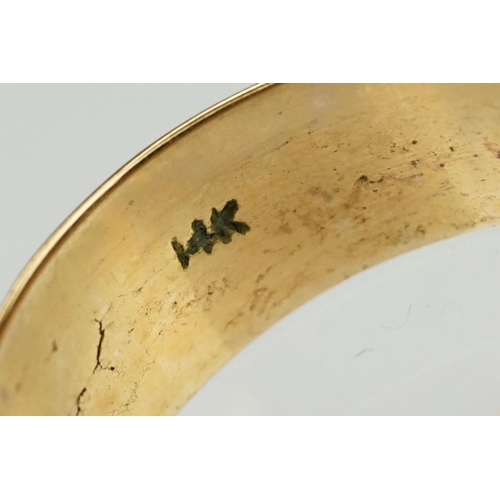 142 - 14ct gold wide band ring of D form. Marked 14k inside band. Size T.