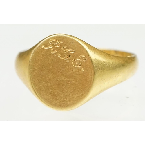 144 - 18ct gold hallmarked signet ring. The ring having an oval head with engraved initials. Partial hallm... 