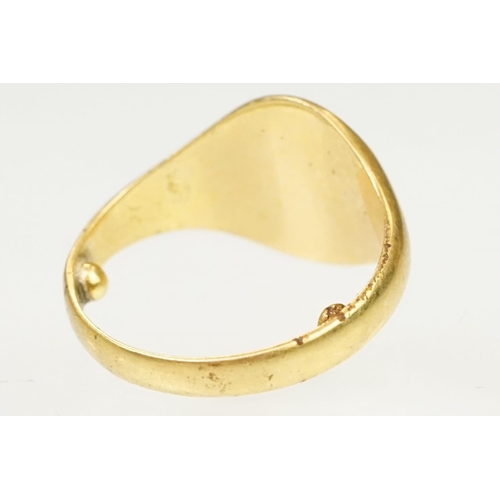 144 - 18ct gold hallmarked signet ring. The ring having an oval head with engraved initials. Partial hallm... 