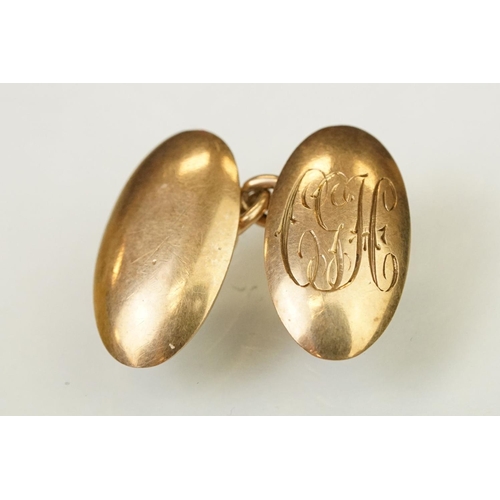 145 - Pair of 1920s 9ct gold hallmarked cufflinks having oval heads with engraved initial panels (hallmark... 