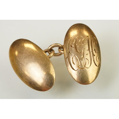 145 - Pair of 1920s 9ct gold hallmarked cufflinks having oval heads with engraved initial panels (hallmark... 