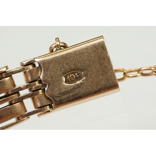 149 - 10ct rose gold gate link bracelet having a tongue in groove clasp with safety chain. Clasp marked 10... 