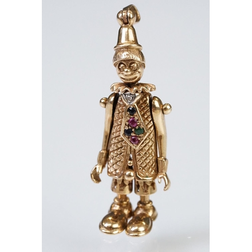 157 - 9ct gold hallmarked clown pendant having articulated limbs set with coloured stones to the tie. Impo... 