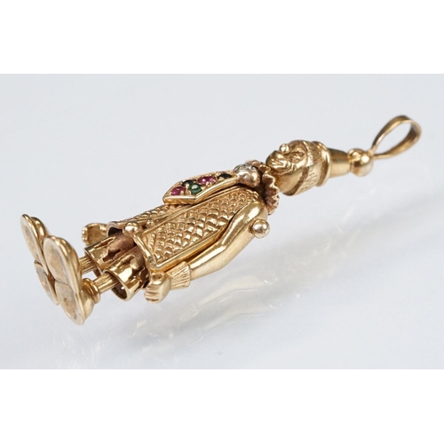 157 - 9ct gold hallmarked clown pendant having articulated limbs set with coloured stones to the tie. Impo... 