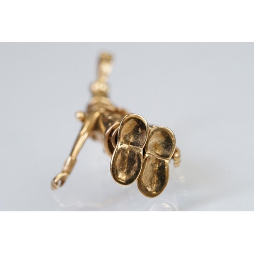 157 - 9ct gold hallmarked clown pendant having articulated limbs set with coloured stones to the tie. Impo... 