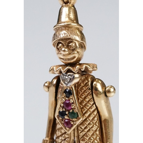 157 - 9ct gold hallmarked clown pendant having articulated limbs set with coloured stones to the tie. Impo... 