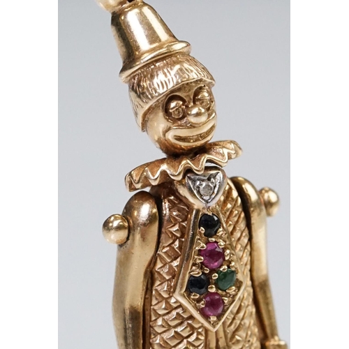 157 - 9ct gold hallmarked clown pendant having articulated limbs set with coloured stones to the tie. Impo... 