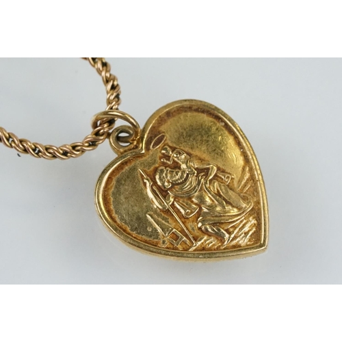 174 - Hallmarked 9ct gold St Christopher pendant necklace. The heart shape pendant suspended from a rope t... 