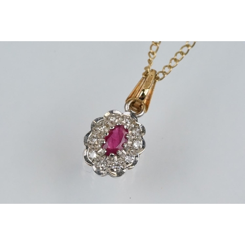 177 - 9ct gold ruby and diamond pendant necklace. The pendant set with an oval cut ruby surrounded by diam... 