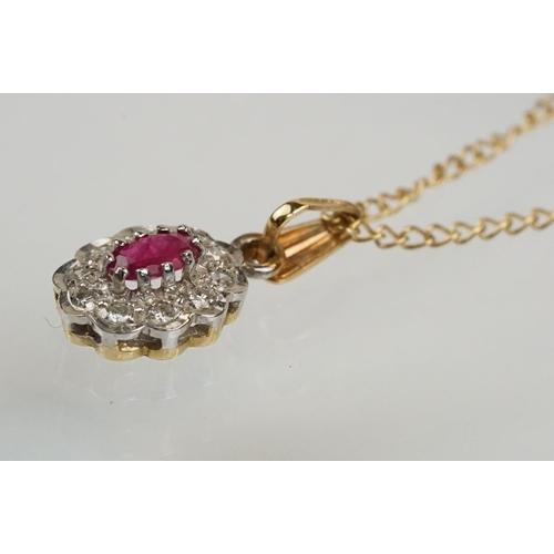 177 - 9ct gold ruby and diamond pendant necklace. The pendant set with an oval cut ruby surrounded by diam... 