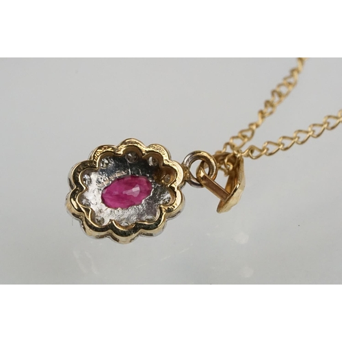 177 - 9ct gold ruby and diamond pendant necklace. The pendant set with an oval cut ruby surrounded by diam... 