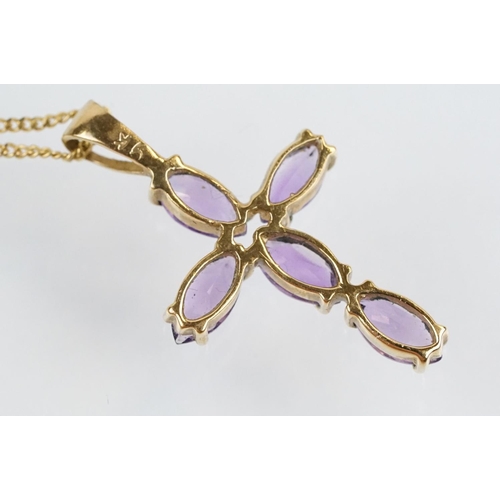 194 - 9ct gold and amethyst cross pendant necklace having a fine link chain with spring ring clasp, the pe... 