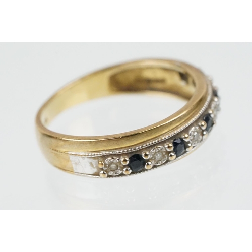 198 - 9ct gold sapphire and diamond ring set with alternate round cut stones to the head within a twin ton... 