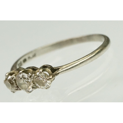 20 - Platinum and diamond three stone ring. The ring being set with three round brilliant cut diamonds in... 