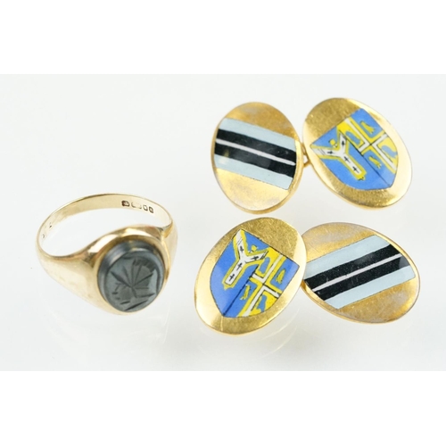 209 - 9ct gold hallmarked hematite signet ring being set with an oval panel to the head engraved with a ro... 