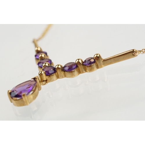 221 - 9ct gold hallmarked amethyst collar necklace having a pear cut amethyst and five round cut amethysts... 