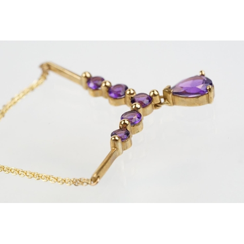 221 - 9ct gold hallmarked amethyst collar necklace having a pear cut amethyst and five round cut amethysts... 