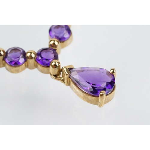 221 - 9ct gold hallmarked amethyst collar necklace having a pear cut amethyst and five round cut amethysts... 