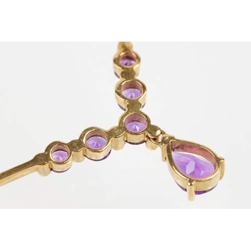 221 - 9ct gold hallmarked amethyst collar necklace having a pear cut amethyst and five round cut amethysts... 