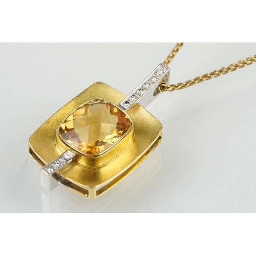 257 - 18ct citrine and diamond pendant necklace being set with a rectangular harlequin cut citrine in a be... 