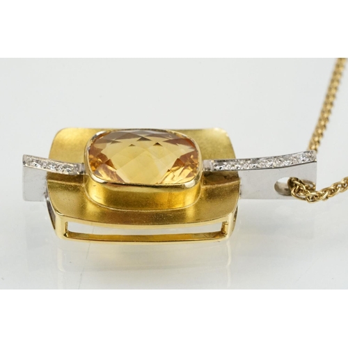 257 - 18ct citrine and diamond pendant necklace being set with a rectangular harlequin cut citrine in a be... 