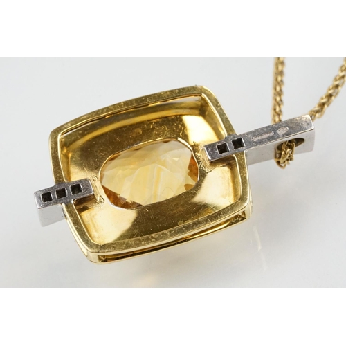 257 - 18ct citrine and diamond pendant necklace being set with a rectangular harlequin cut citrine in a be... 