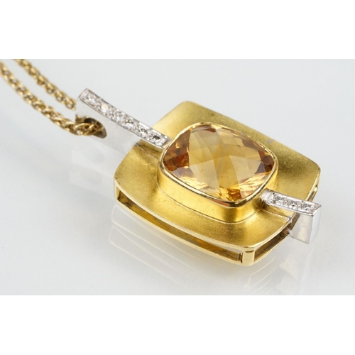 257 - 18ct citrine and diamond pendant necklace being set with a rectangular harlequin cut citrine in a be... 