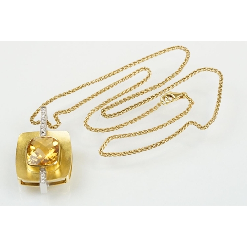 257 - 18ct citrine and diamond pendant necklace being set with a rectangular harlequin cut citrine in a be... 