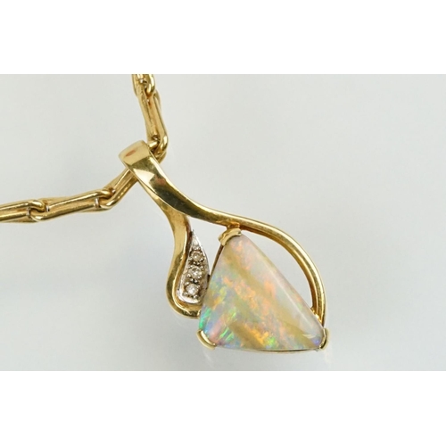 259 - 18ct gold, opal and diamond pendant necklace. The necklace having a triangular boulder opal set with... 