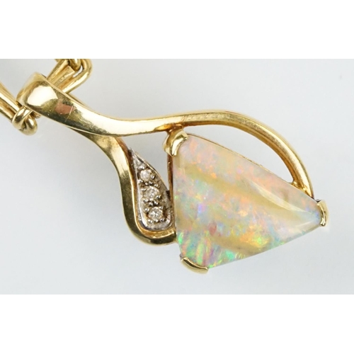 259 - 18ct gold, opal and diamond pendant necklace. The necklace having a triangular boulder opal set with... 