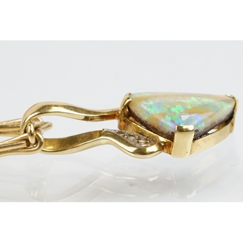 259 - 18ct gold, opal and diamond pendant necklace. The necklace having a triangular boulder opal set with... 