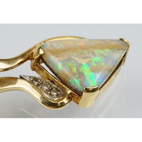 259 - 18ct gold, opal and diamond pendant necklace. The necklace having a triangular boulder opal set with... 