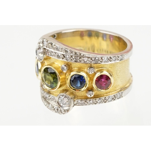 264 - 18ct gold, ruby, sapphire and diamond ring. The ring bezel set with a green round cut sapphire to ce... 