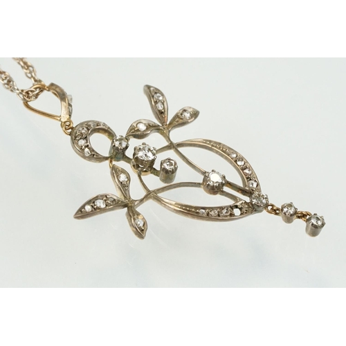 265 - Early 20th Century Art Nouveau silver and gold diamond set foliate design pendant being set with sev... 