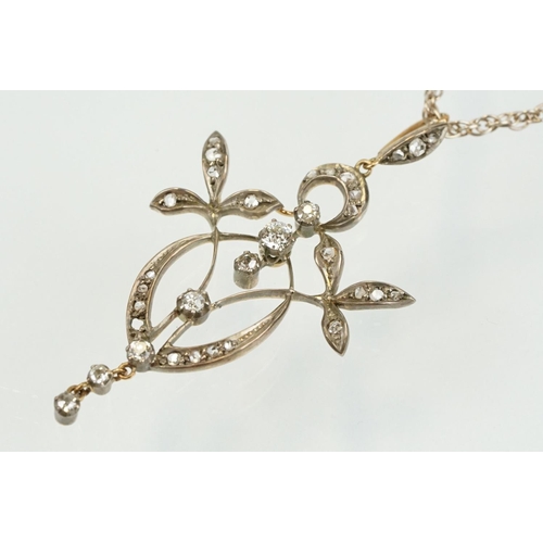 265 - Early 20th Century Art Nouveau silver and gold diamond set foliate design pendant being set with sev... 