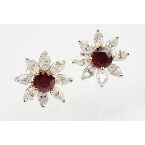 267 - Pair of 18ct white gold ruby and diamond cluster earrings each being set with round cut rubies to th... 