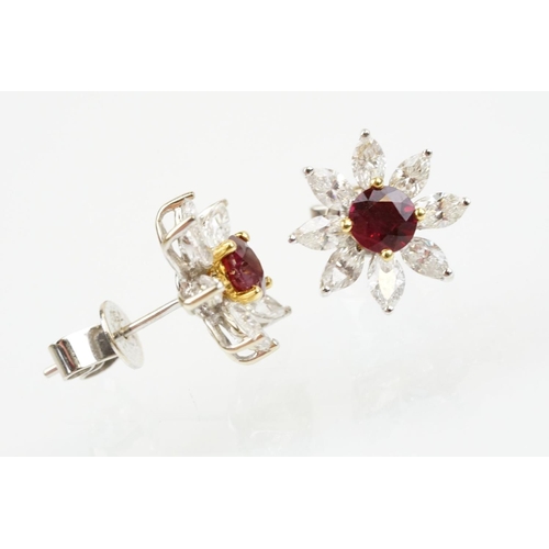 267 - Pair of 18ct white gold ruby and diamond cluster earrings each being set with round cut rubies to th... 