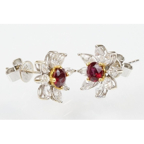 267 - Pair of 18ct white gold ruby and diamond cluster earrings each being set with round cut rubies to th... 