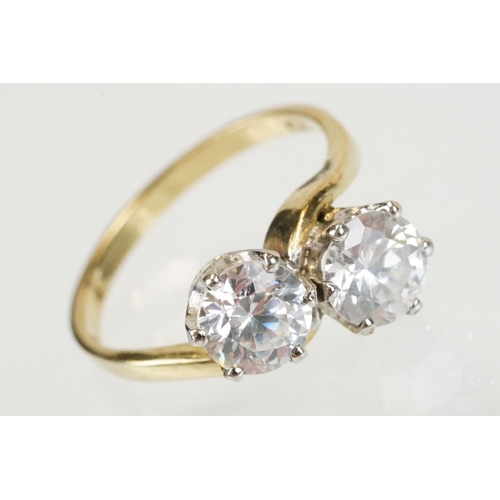 268 - 9ct gold and white stone toi et moi ring set with two round brilliant cut white stones. Hallmarked S... 