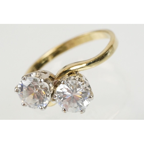 268 - 9ct gold and white stone toi et moi ring set with two round brilliant cut white stones. Hallmarked S... 