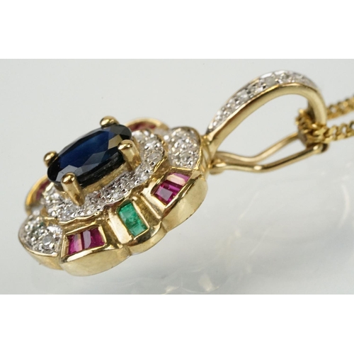 269 - 9ct gold sapphire, ruby, emerald and diamond pendant set with an oval cut sapphire to centre surroun... 