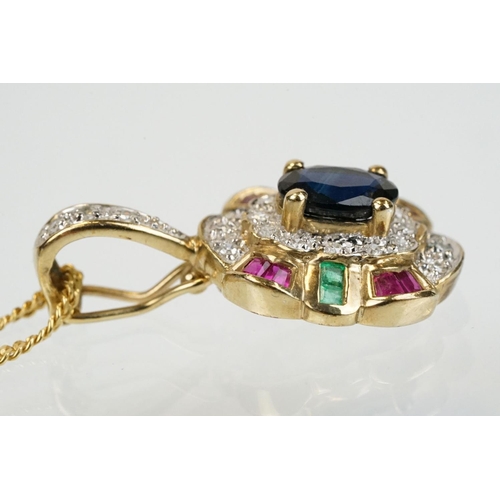 269 - 9ct gold sapphire, ruby, emerald and diamond pendant set with an oval cut sapphire to centre surroun... 