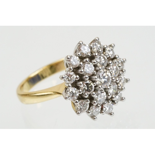 270 - 18ct gold and diamond nineteen stone diamond cluster ring. The ring being set with a central diamond... 