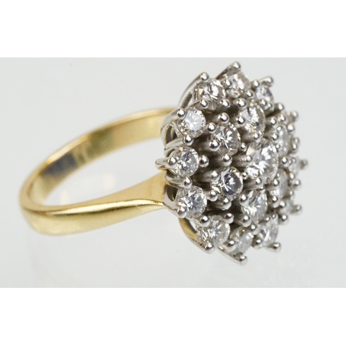 270 - 18ct gold and diamond nineteen stone diamond cluster ring. The ring being set with a central diamond... 