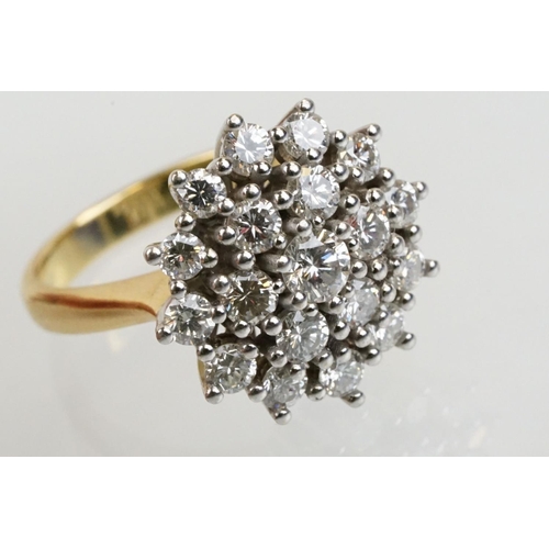 270 - 18ct gold and diamond nineteen stone diamond cluster ring. The ring being set with a central diamond... 