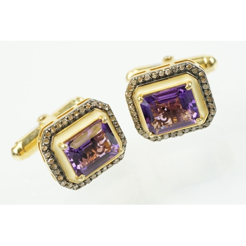 273 - Pair of silver amethyst and diamond set cufflinks being set with emerald cut amethysts to centre sur... 